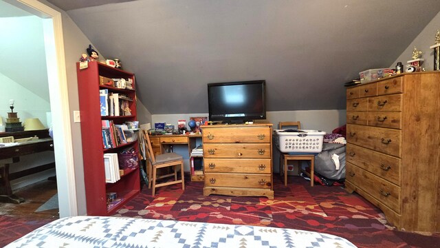 2670 Bennoch Rd, Old Town, ME 04468 - bedroom with lofted ceiling and dark carpet