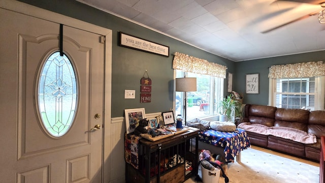 2670 Bennoch Rd, Old Town, ME 04468 - entryway with a wainscoted wall, a ceiling fan, and crown molding