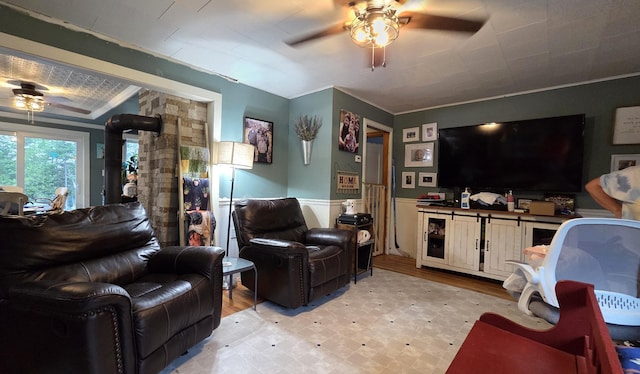 2670 Bennoch Rd, Old Town, ME 04468 - living area with a ceiling fan, crown molding, wainscoting, and light wood-type flooring