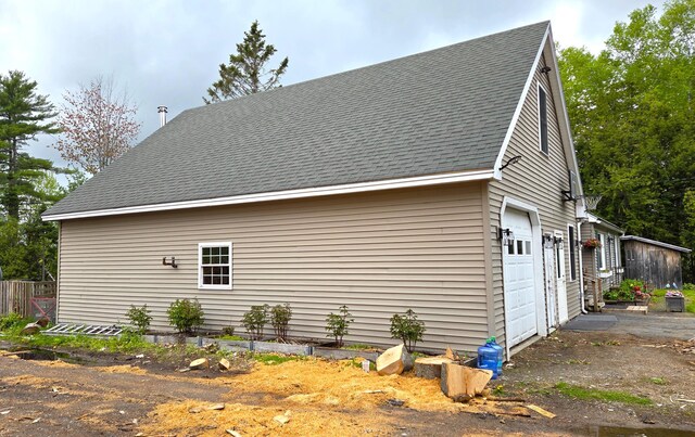 2670 Bennoch Rd, Old Town, ME 04468 - view of side of property featuring roof with shingles