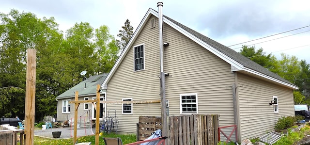 2670 Bennoch Rd, Old Town, ME 04468 - rear view of property featuring a patio area and a shingled roof