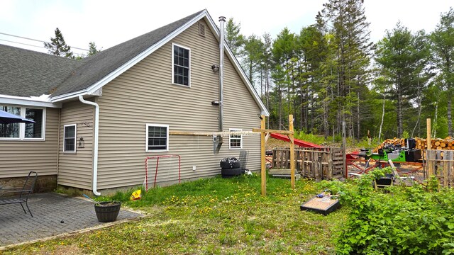 2670 Bennoch Rd, Old Town, ME 04468 - view of side of property featuring a patio area