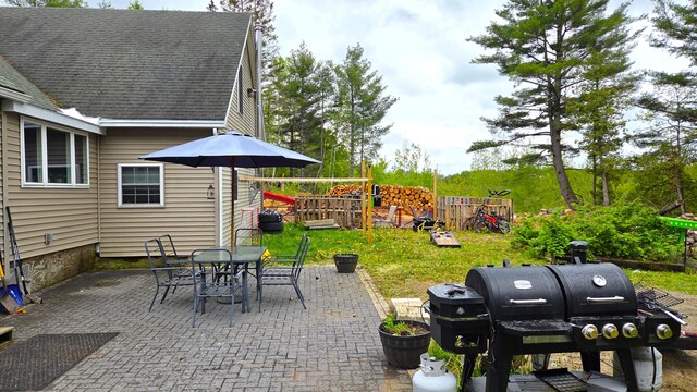 2670 Bennoch Rd, Old Town, ME 04468 - view of patio featuring grilling area and outdoor dining area