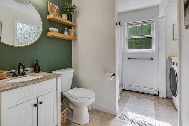 6 Emerald Ct, Berwick, ME 03901 - bathroom with a baseboard heating unit, toilet, tile patterned flooring, vanity, and washer / dryer