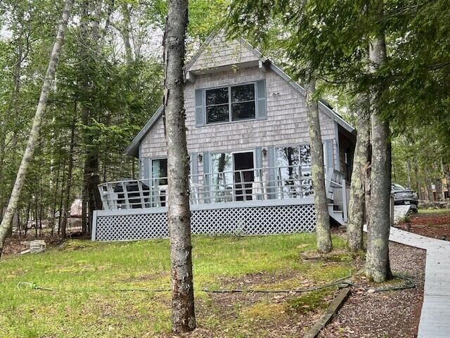166 Ridge Rd, Frye Island, ME 04071 - rear view of house featuring a wooden deck and a lawn