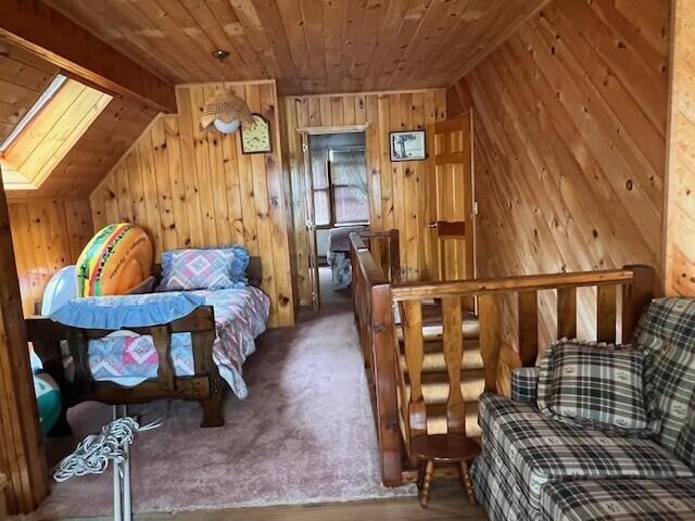 166 Ridge Rd, Frye Island, ME 04071 - bedroom featuring wood ceiling, wooden walls, and vaulted ceiling
