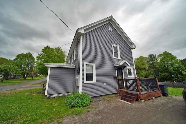 29 Columbia St, Houlton, ME 04730 - rear view of property with a wooden deck