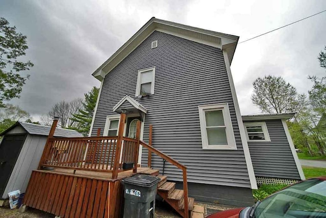 29 Columbia St, Houlton, ME 04730 - rear view of house featuring a wooden deck