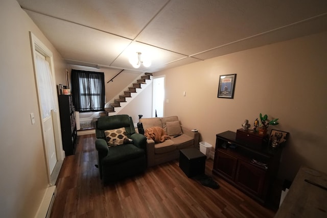 29 Columbia St, Houlton, ME 04730 - living area featuring stairway, wood finished floors, baseboard heating, and baseboards