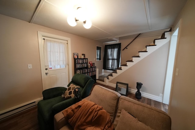 29 Columbia St, Houlton, ME 04730 - living area with stairs, a baseboard heating unit, wood finished floors, and baseboards