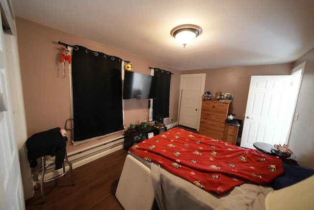 29 Columbia St, Houlton, ME 04730 - bedroom featuring dark wood finished floors, baseboard heating, and baseboards