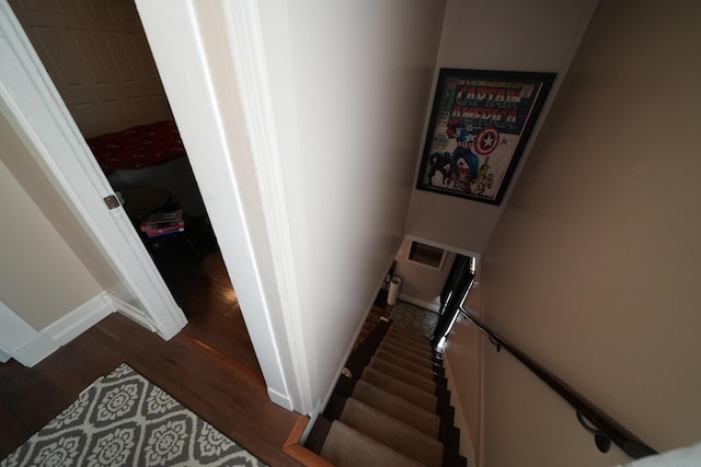 29 Columbia St, Houlton, ME 04730 - staircase featuring wood finished floors and baseboards