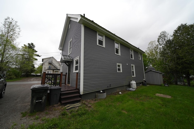 29 Columbia St, Houlton, ME 04730 - view of side of property featuring a yard and a deck