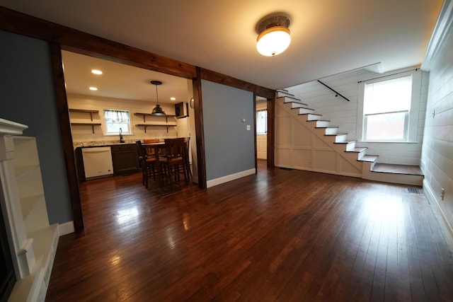 29 Columbia St, Houlton, ME 04730 - unfurnished living room featuring stairway, dark wood-type flooring, and baseboards