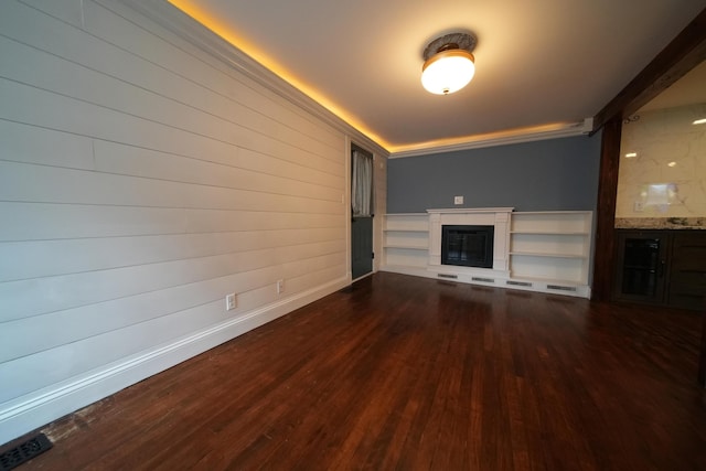 29 Columbia St, Houlton, ME 04730 - unfurnished living room featuring dark wood-style flooring, a glass covered fireplace, and baseboards