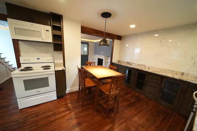 29 Columbia St, Houlton, ME 04730 - kitchen featuring white appliances, decorative backsplash, dark wood-style floors, and light stone countertops