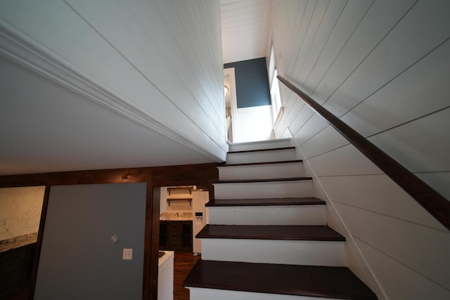 29 Columbia St, Houlton, ME 04730 - stairs with wooden walls and wood finished floors