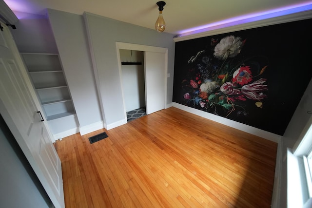 29 Columbia St, Houlton, ME 04730 - unfurnished bedroom featuring wood finished floors and baseboards