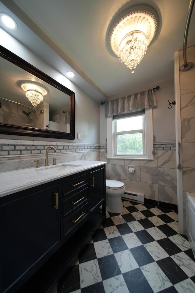 29 Columbia St, Houlton, ME 04730 - full bathroom with tile walls, a chandelier, vanity, baseboard heating, and toilet