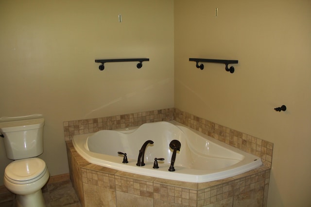 89 Drake Rd, Madison, ME 04950 - bathroom with a garden tub and toilet
