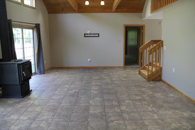 89 Drake Rd, Madison, ME 04950 - unfurnished living room with wood ceiling with exposed beams, healthy amount of natural light, stairs, high vaulted ceiling, and baseboards