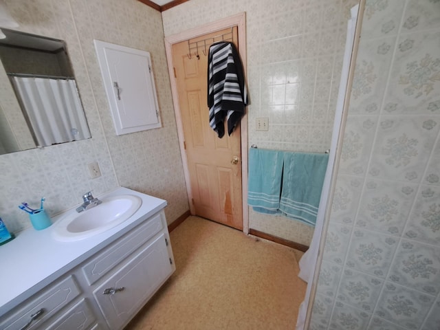 14 Somerset St, Millinocket, ME 04462 - full bathroom featuring vanity, wallpapered walls, and a shower with shower curtain