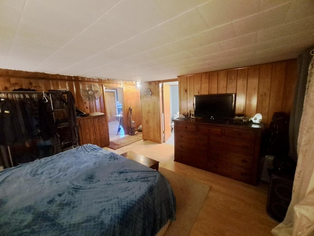 14 Somerset St, Millinocket, ME 04462 - bedroom with wooden walls and light wood-style floors