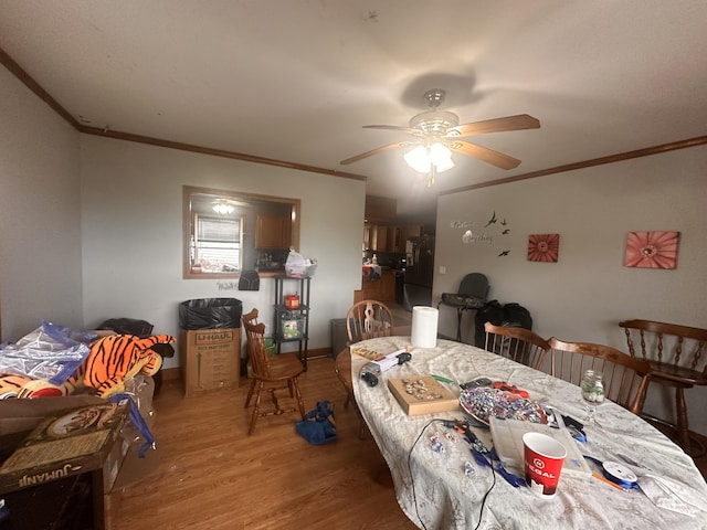 187 Purkis Rd, Buckfield, ME 04220 - dining space featuring crown molding, wood finished floors, and a ceiling fan