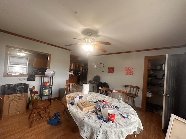 187 Purkis Rd, Buckfield, ME 04220 - dining area featuring ceiling fan, wood finished floors, and ornamental molding