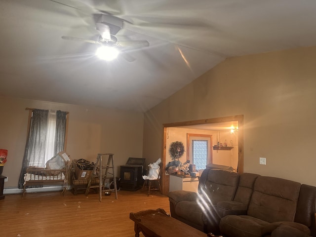 187 Purkis Rd, Buckfield, ME 04220 - living area with a ceiling fan, wood finished floors, vaulted ceiling, and a wood stove