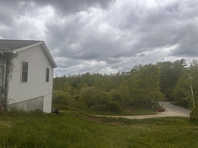 187 Purkis Rd, Buckfield, ME 04220 - view of yard featuring a wooded view