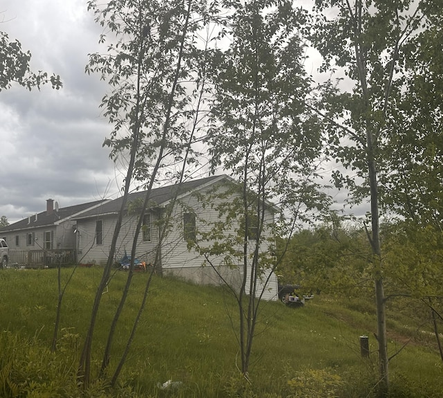 187 Purkis Rd, Buckfield, ME 04220 - view of property exterior featuring a yard and a chimney
