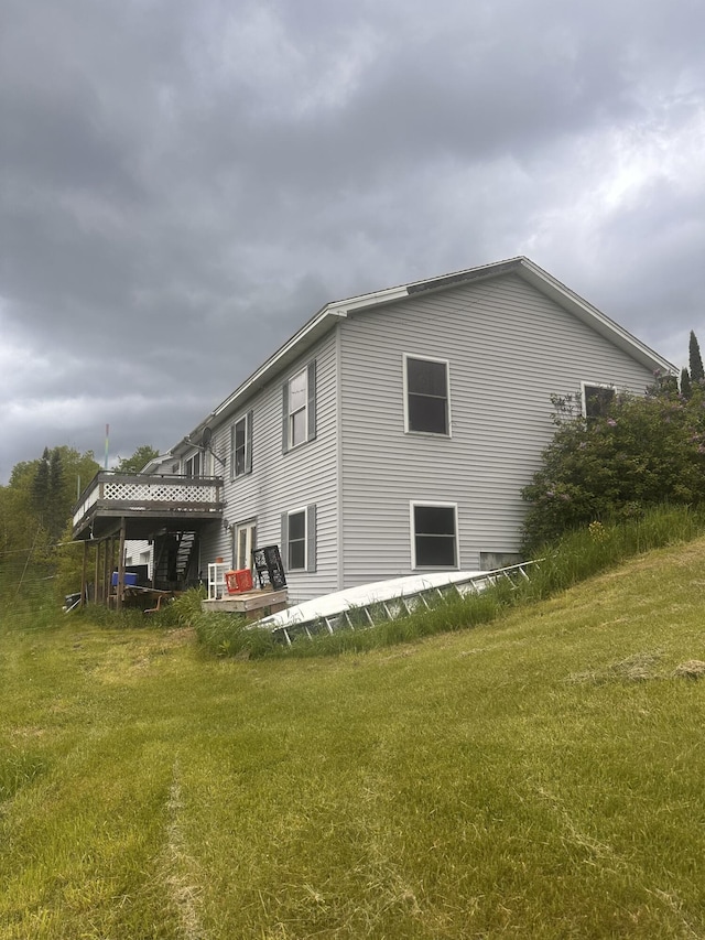 187 Purkis Rd, Buckfield, ME 04220 - back of property featuring a lawn and a wooden deck
