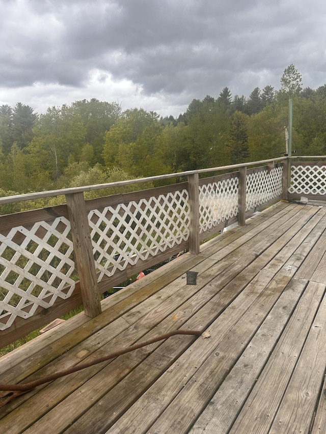187 Purkis Rd, Buckfield, ME 04220 - wooden terrace with a wooded view