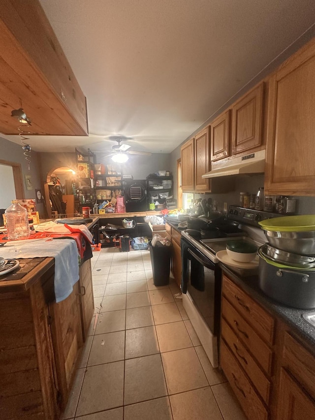 187 Purkis Rd, Buckfield, ME 04220 - kitchen featuring under cabinet range hood, electric stove, light tile patterned flooring, a ceiling fan, and dark countertops