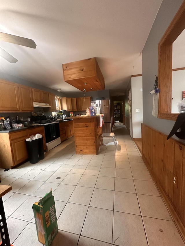 187 Purkis Rd, Buckfield, ME 04220 - kitchen featuring range with electric cooktop, under cabinet range hood, and light tile patterned floors