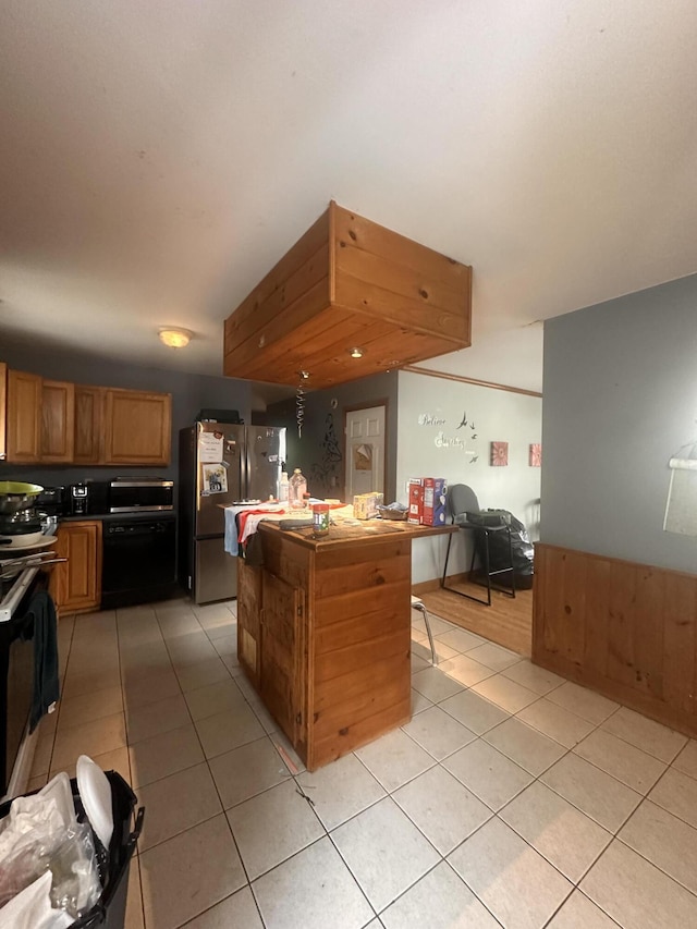 187 Purkis Rd, Buckfield, ME 04220 - kitchen featuring freestanding refrigerator, light tile patterned floors, a center island, electric stove, and open floor plan