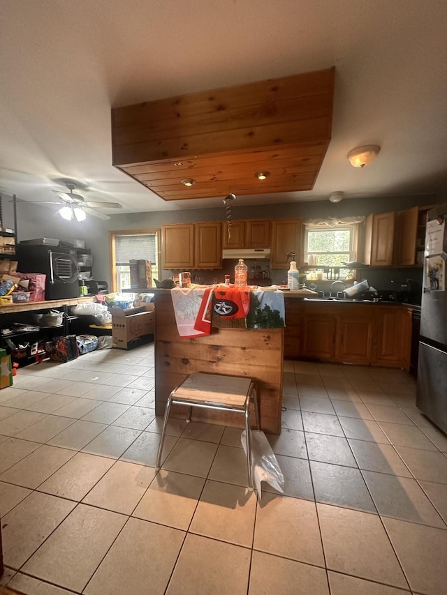 187 Purkis Rd, Buckfield, ME 04220 - kitchen featuring light tile patterned flooring, freestanding refrigerator, a center island, and ceiling fan