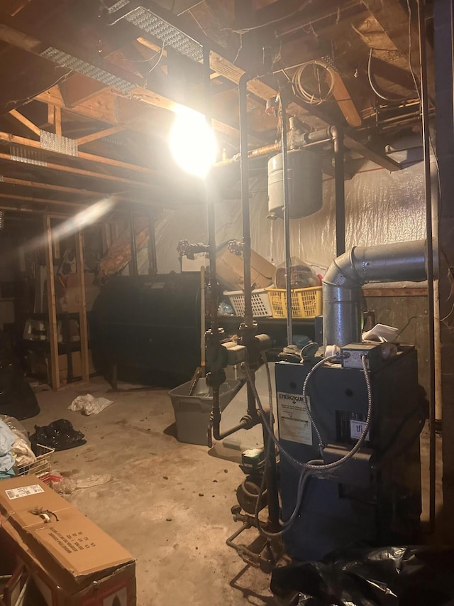187 Purkis Rd, Buckfield, ME 04220 - unfinished below grade area with oil tank and a heating unit