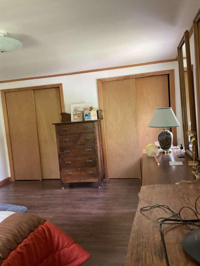 264 Watson Hill Rd, Limerick, ME 04048 - bedroom with dark wood-type flooring and crown molding