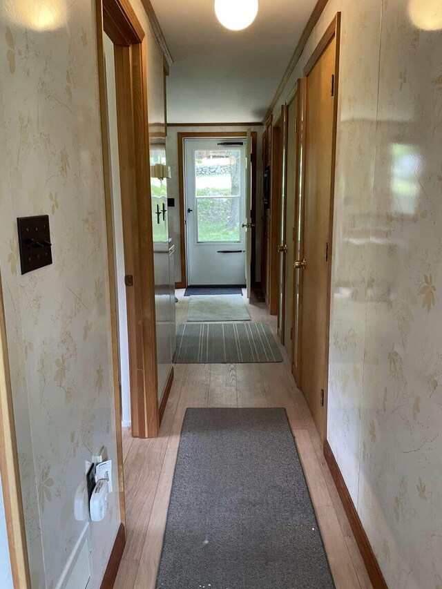 264 Watson Hill Rd, Limerick, ME 04048 - hallway featuring light wood-style floors and wallpapered walls