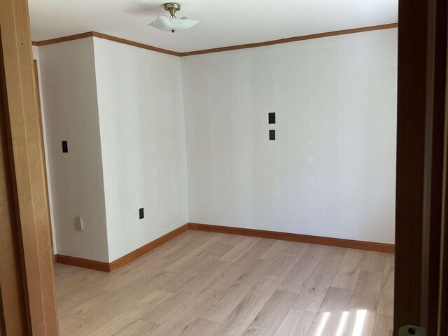 264 Watson Hill Rd, Limerick, ME 04048 - spare room with light wood-type flooring, ornamental molding, and baseboards
