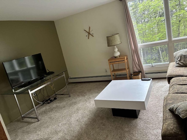 2011 Clark St, Carrabassett Valley, ME 04947 - carpeted living area with a baseboard heating unit