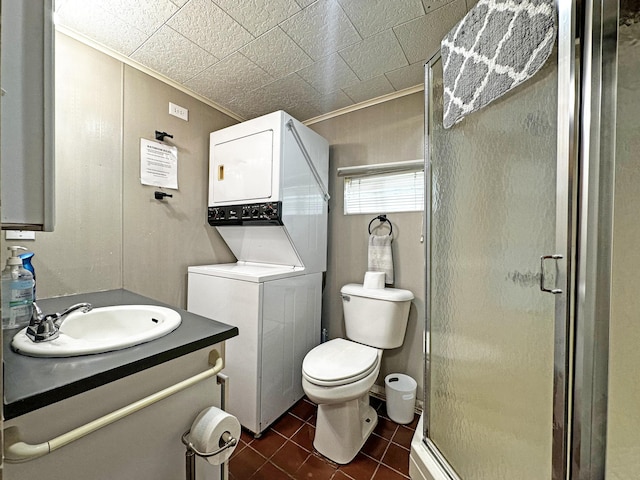 144 Sinclair Rd, Sinclair, ME 04779 - full bathroom with stacked washer / dryer, vanity, a shower stall, tile patterned flooring, and crown molding