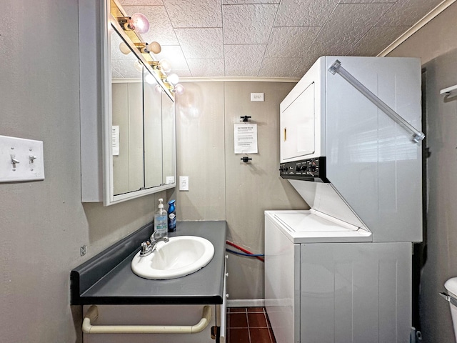144 Sinclair Rd, Sinclair, ME 04779 - bathroom featuring stacked washer / drying machine, vanity, and toilet