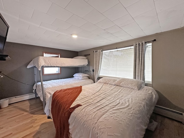 144 Sinclair Rd, Sinclair, ME 04779 - bedroom with wood finished floors and a baseboard heating unit
