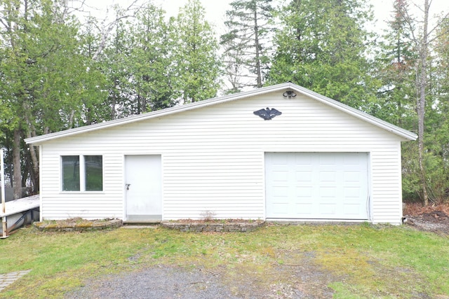 144 Sinclair Rd, Sinclair, ME 04779 - view of front of home with a detached garage, an outdoor structure, and a front lawn