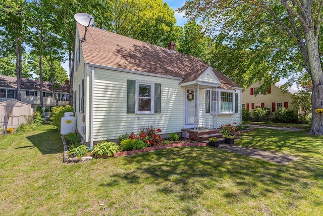 4 Hillside Ave, Biddeford, ME 04005 - view of front of property featuring a front yard and roof with shingles