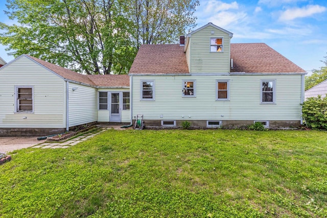 4 Hillside Ave, Biddeford, ME 04005 - rear view of property featuring a yard, a chimney, and roof with shingles