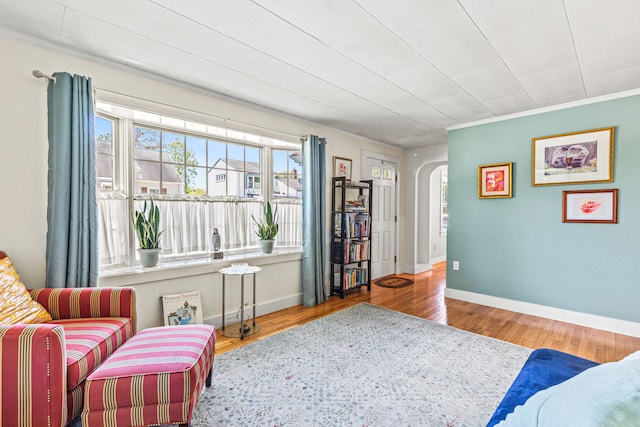 4 Hillside Ave, Biddeford, ME 04005 - living area featuring arched walkways, wood finished floors, and baseboards